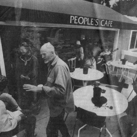 Diners outside a building with 