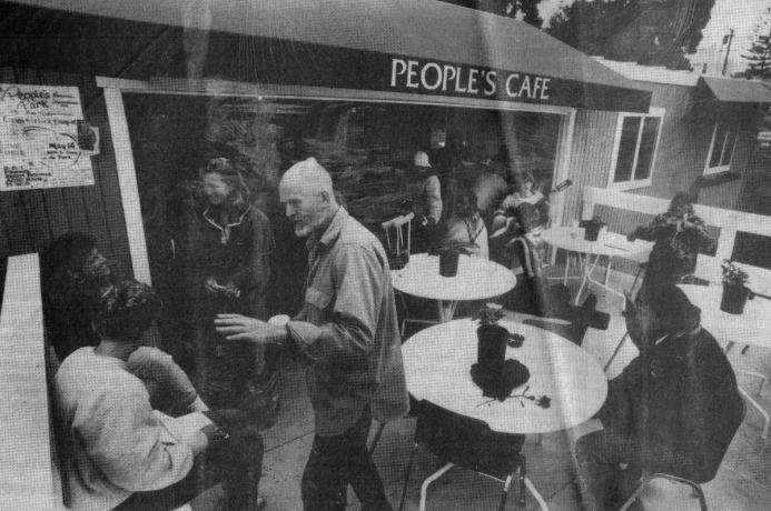 Diners outside a building with 