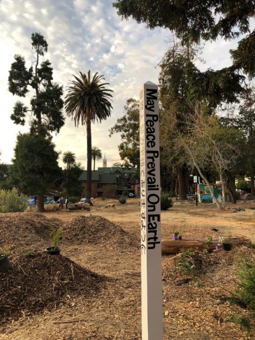 Peace pole in People's Park reads 